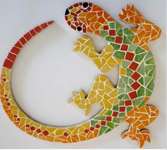 a colorful lizard made out of small tiles