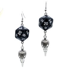 For Raven Queen worshippers who don't want to wear our huge and heavy (but very cool) raven earrings, we also offer this smaller, lighter (but still very cool) version. Each has a pearl black D20. Beneath the dice hang silvery raven skull charms. These would be a perfect accessory for someone playing a member of the shadar-kai or a cleric that worships the Raven Queen. A great gift for players of D&D, Pathfinder, and other tabletop RPGs -- or for anyone who wants to geek out with a fun and myste Black Skull Earrings For Gift, Adjustable Black Skull Earrings, Adjustable Black Skull-shaped Earrings, Black Novelty Drop Earrings, Black Fantasy Style Earrings, Black Fantasy Earrings, Black Fantasy Style Pierced Earrings, Nickel Free Black Skull Earrings, Black Fantasy Dangle Jewelry