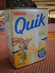 a carton of nestle quik sitting on a table