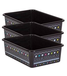 three black plastic containers with designs on the sides and one is filled with colored dots