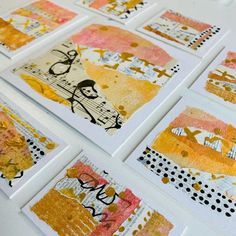 many different cards are arranged on a table top with polka dot dots and yellow, pink, black and white designs