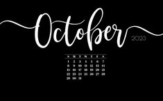 a calendar with the word october written in cursive ink on black paper,