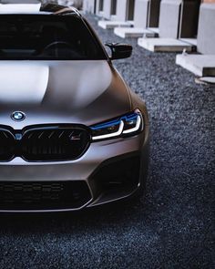 the front end of a silver bmw car