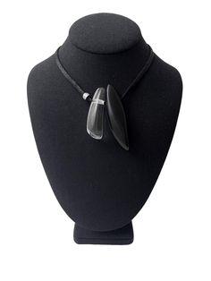 A simple but elegant black color cotton cord with one black matte resin pendant and one clear resin pendant.  The perfect look for the minimalist to make an impression.  The necklace is adjustable, and you can wear it as a choker or as long as 29 IN.  Lightweight and easy to travel. Black Minimalist Jewelry With Adjustable Cord, Modern Adjustable Choker Necklace, Modern Adjustable Pendant Necklaces, Modern Adjustable Black Jewelry, Modern Black Choker Jewelry, Modern Adjustable Black Choker, Trendy Black Jewelry With Adjustable Cord, Modern Black Glass Jewelry, Minimalist Black Choker With Adjustable Length