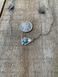 This dainty little arrowhead is the perfect addition to your southwestern style! It is so cute layered with other necklaces or on its own! It has a 4mm turquoise dot in the center and has southern style stamping surrounding the stone. **No turquoise stone is the same so colors will vary** Bohemian Silver Arrowhead Necklace, Arrowhead Jewelry, Western Type, Livestock Fence, Arrowheads Jewelry