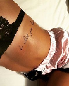 a woman's panties with writing on the bottom of her stomach and an inscription written in cursive ink