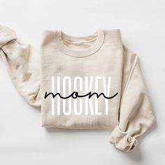 a white sweatshirt with the word hoooky on it and a bow at the front