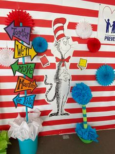 dr seuss and the cat in the hat bulletin board with paper pom poms