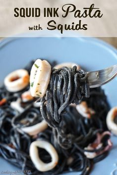 a fork full of pasta with squid on it and the words squid ink pasta with squids