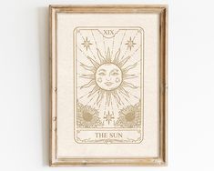 the sun tarot card mounted on a wall