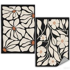 two black and white rugs with flowers on them