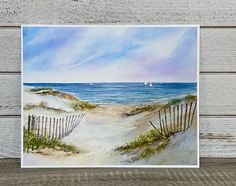 a painting of a beach scene with sailboats in the water and sand dunes to the side