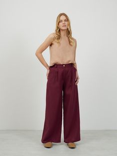 "ASHER is a high waisted tailored wide leg linen pants. DETAILS - High waisted - Seam pockets - Wide leg - Two front darts - Features hidden zip and the button in front - Elasticated back - 100% lightweight European linen fabric - Cut and sewn to order just for you in our studio COLOR - Eggplant, you can also choose other colors above - Fabric samples are available here https://www.etsy.com/listing/586569696/linen-fabric-samples SIZING & FIT - Fits true to size - Model is 5'8\" / 173cm and wearing a size S CARE FOR LINEN - Machine wash up to 30ºC/86ºF gentle cycle - Lay flat to dry or tumble dry low - Warm iron if needed - Do not bleach SIZE GUIDE Size conversion guide Size XS (US 0-2, IT 36-38, UK 4-6, Japan 3-5, France 32-34) Size S (US 4-6, IT 40-42, UK 8-10, Japan 7-9, France 36-38) Si High Waist Linen Wide Leg Pants With Pockets, High-waisted Linen Wide Leg Pants For Work, High-waisted Linen Wide Leg Pants, Loosely Fitted Linen Wide Leg Pants For Work, High Waist Linen Wide Leg Pants, Linen Wide-leg Pants With Welt Pockets, Ankle-length Linen Wide Leg Pants With Welt Pockets, Linen Wide-leg Culottes For Work, Wide Leg Linen Culottes For Work