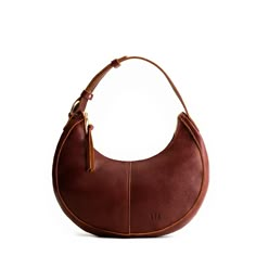 Nutmeg*Classic | Crescent shaped shoulder bag with zipper closure and adjustable strap Portland Leather Bags, Italian Honeymoon, Dragon Bones, Portland Leather Goods, Classic Purse, Crescent Bag, Best Crossbody Bags, Puffy Jacket, Almost Perfect