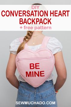 the back of a girl wearing a pink heart shaped backpack that says, conversation heart backpack + free pattern