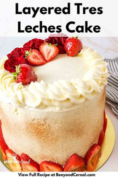 a cake with strawberries on top and the words layered tress leches cake above it