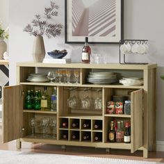 a wooden cabinet with wine glasses and plates on it