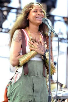 a woman that is standing in front of a microphone