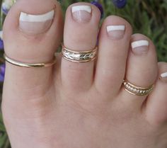 SAME DAY SHIPPING on orders received by 12 PM PST FREE FIRSTCLASS SHIPPING in U.S. on orders $35.00 or more! FREE INTERNATIONAL FIRST CLASS on orders $100.00 or more! SIZING METHOD for Toe or Midi Rings: 1) For Toe Rings, use half of your shoe size, or your full pinkie size (80% accurate) 2) Measure your Toe/Finger using a string or Dental Floss * With a piece of string or dental floss, wrap it snugly but not tight at the part of the toe/midi where you want the ring will lay (on the toes, typica Toe Ring Designs, Gold Toe Rings, Rings Stacking, Plastic Ring, Silver Stacking Rings, Pearl Cream, Toe Ring, Ruby Earrings, Midi Rings