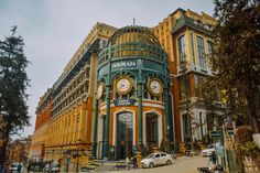 a large building with a clock on it's side