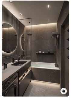 a bathroom with a sink, mirror and bathtub next to each other in it