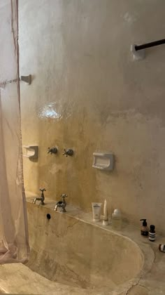 a bath tub sitting next to a shower in a bathroom