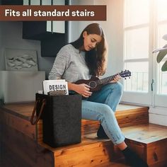 a woman sitting on the steps playing an acoustic guitar with text overlay that reads fits all standard stairs