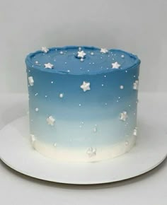 a blue and white cake with stars on it