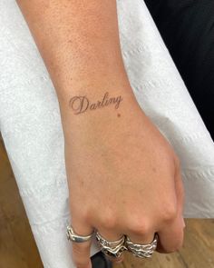 a person with a tattoo on their wrist