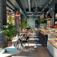 the inside of a restaurant with tables and chairs