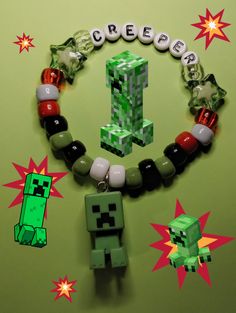 an image of a bracelet made out of legos and beads on a green background