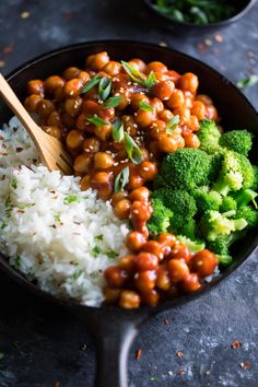 a bowl filled with rice, beans and broccoli on top of a table