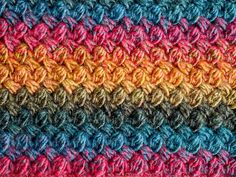 multicolored crocheted blanket made with yarn