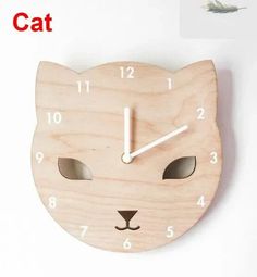 a wooden clock with a cat face on it