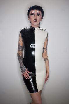 "Miserable, Darling, As Usual. Perfectly Wretched." Black and white latex mid length dress with high neck, cropped shoulders and spike detailing - Super comfortable, stretchy latex fit. - back zip for ease of putting on - Made to your sizing - Spikes customisable upon request - Length customisable upon request Gothic White Mini Dress For Parties, White Gothic Mini Dress For Party, White Fitted Gothic Mini Dress, White Sleeveless Gothic Dress, Latex Dress Halloween Costume, Edgy Sleeveless Dress For Costume Party, Dress With High Neck, Clothes Board, Vinyl Dress