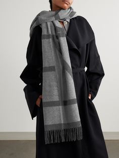 Emblazoned with a scaled-up version of its minimal jacquard-knit logo, TOTEME's scarf will keep you warm  and  chic throughout the cooler months. It's made from the softest wool and has fringed trims. Wrap it around the shoulders of a relaxed coat. Toteme Scarf, Wool Jacquard Knit Outerwear With Shawl Collar, Toteme Wool Scarf, Luxury Winter Scarves With Fringe, Cashmere Long Sleeve Jacquard Knit Outerwear, Sports Skirts, Sport Swimwear, Jacquard Knit, Fringe Trim