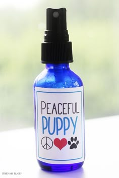 a blue bottle with the words peaceful puppy on it and a dog paw in the background