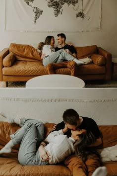 a man and woman cuddle on a couch in front of a world map hanging above them