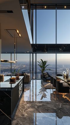 the kitchen is very large and has glass walls to look out on the cityscape