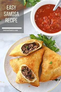 two pastries on a plate with tomato sauce and parsley garnishes