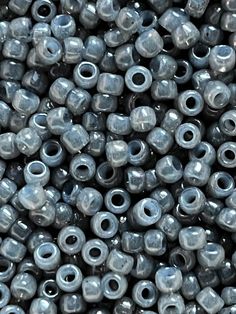 many gray beads are stacked on top of each other