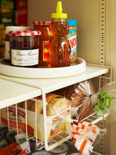 there are many jars and containers in the refrigerators that are filled with food items