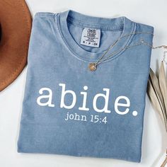 Abide Christian Shirt John 15:4 P R O D U C T I N F O : ♥ Comfort Colors 1717 ♥ Unisex Adult Sizing ♥ Direct to garment printing ♥ 100% Ring-spun cotton = long lasting comfort ♥ Rolled sleeves in photos are for styling purposes only **Props used in photos are NOT included with shirt** W A S H I N G I N S T R U C T I O N S ♥ Wash inside out, in cold water and on gentle cycle. ♥ Tumble Dry Low ♥ Do not Bleach or use Fabric Softeners ♥ Do not dry clean ♥ Do not iron design S I Z E ♥ Please use our Circut Joy, Christian Gift Shop, John 15 4, Diy Shirts, Iron Design, Gift Shops, Tshirt Ideas, Closet Goals, Youth Group