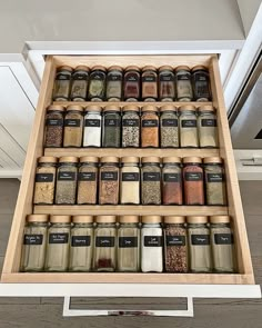 an organized spice rack in a kitchen