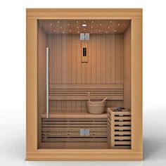 an empty sauna with two wooden crates in it