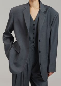 Color: Dark Grey Melange Midweight traditional suiting fabric Oversized tailored silhouette Padded shoulders Button front closure Flap front pockets Lined 65% Lyocell 25% Rayon 10% Wool Dry Clean By The Frankie Shop. Imported Dark Grey Suit Women, Dark Grey Clothes, Dark Gray Outfit, Oversized Suit Women, Dark Grey Outfit, Aesthetic Suits, Suits Aesthetic, Dark Grey Dress, Suit Aesthetic