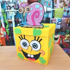 a yellow box with a pink number one on it sitting on top of a table