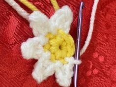 the crochet flower is being worked on