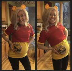 a woman in a winnie the pooh costume is smiling and holding her belly up