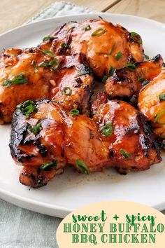 grilled chicken on a white plate with green garnish and text overlay that reads sweet & spicy honey buffalo bbq chicken